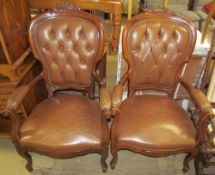 A pair of continental upholstered elbow chairs