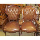 A pair of continental upholstered elbow chairs