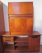 A 20th century teak sideboard together with a similar bureau