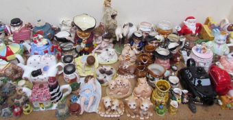 A large lot including novelty teapots, character jug,