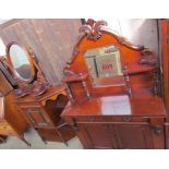 A Victorian mahogany chiffonier with a mirrored back,