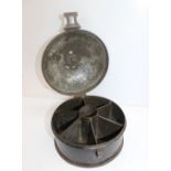 A 19th century toleware spice container, the circular lid enclosing a six division interior,
