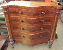 A Victorian mahogany chest with a serpentine top above two short and three long graduated drawers