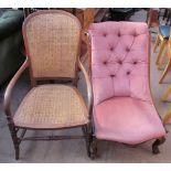 A Victorian rosewood nursing chair with button back upholstery on scrolling legs and feet together