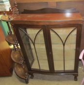 A 20th century mahogany display cabinet together with a walnut whatnot