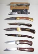 Two French horn handled folding pocket knives together with six other folding pocket knives