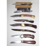 Two French horn handled folding pocket knives together with six other folding pocket knives