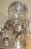 Electroplated trays and a part tea set together with glass decanters and glass bells