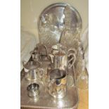 Electroplated trays and a part tea set together with glass decanters and glass bells