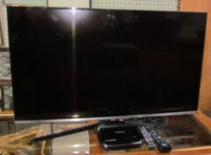 A Samsung 40" flat screen television together with a Humax Freesat (Sold as seen,