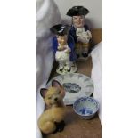 A lidded toby jug of a snuff taker together with another Toby jug, Wade Siamese cat blow up,