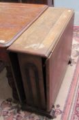 A 20th century oak gate leg dining table together with a set of four oak dining chairs