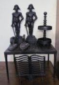 A pair of cast iron door stops in the form of soldiers together with a cast iron footman,