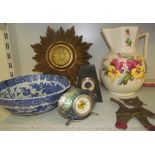 A gilt decorated star burst clock together with a blue and white pottery bowl, jug,