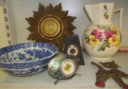 A gilt decorated star burst clock together with a blue and white pottery bowl, jug,