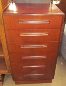 A G-Plan dark teak chest with six graduated drawers on a plinth base