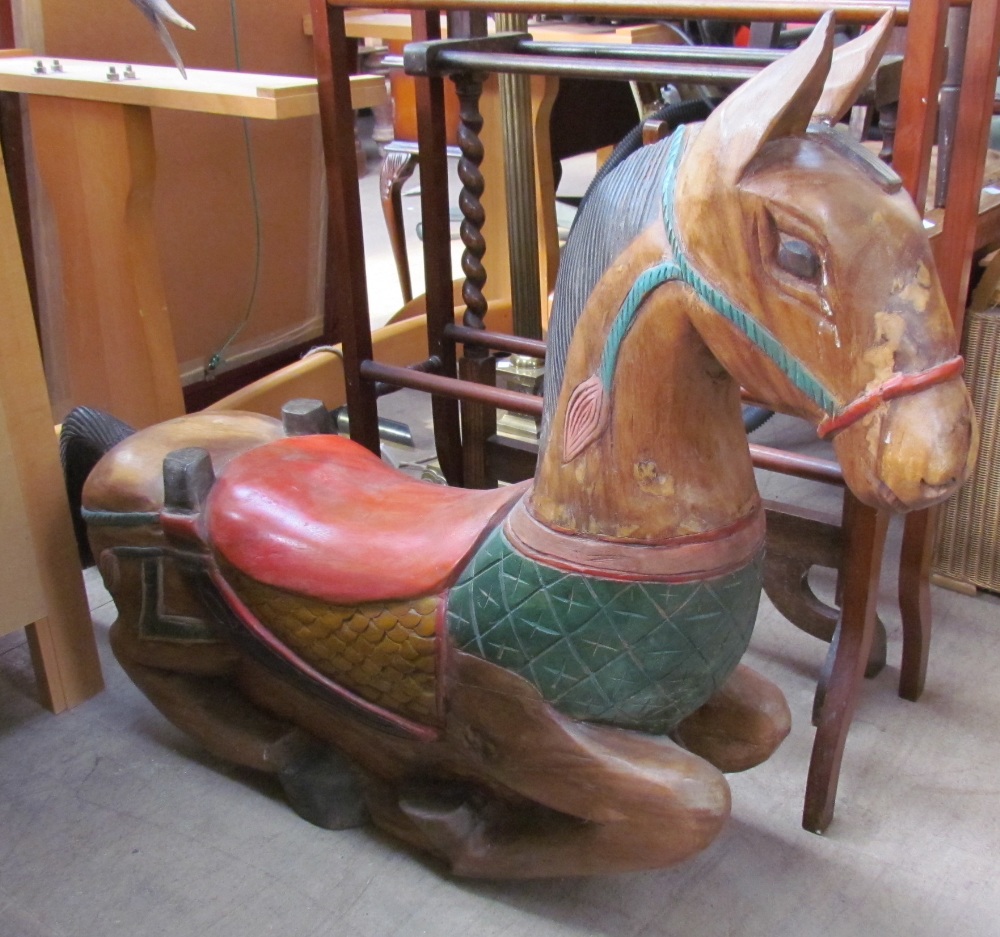 A Child's rocking horse with raised head,