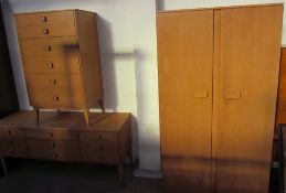 A 20th century oak bedroom suite comprising a wardrobe,