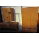A 20th century oak bedroom suite comprising a wardrobe,
