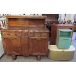 A 20th century oak court cupboard together with a wicker ottoman and a bedside cabinet