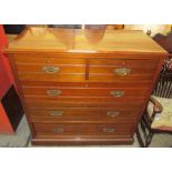 An Edwardian walnut chest,