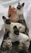 Three Beswick Siamese cats together with three other Beswick cats