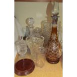 An amber glass and white metal mounted decanter together with glass vases,