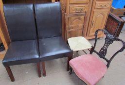 A pair of leather upholstered chairs together with a bedroom chair and an Edwardian nursing chair