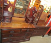 An Edwardian walnut dressing table with three mirrors, the base with two short and two long drawers,