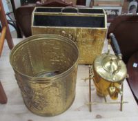 A brass magazine rack together with a brass waste paper basket and a kettle on stand