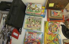 A large collection of DVD's and jigsaws together with tools,