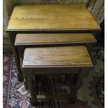 A twentieth century oak nest of three tables