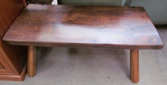 An oak coffee table of rectangular form on four tapering legs