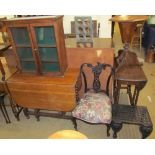 An oak gate leg dining table together with a table top display cabinet,