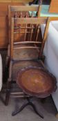 A pair of 19th century spindle back dining chairs together with a wine table