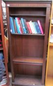 A reproduction mahogany bookcase