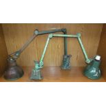 A pair of industrial style angle poise lamps