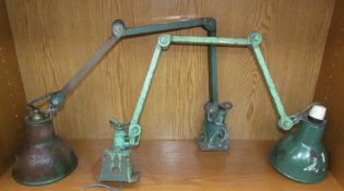 A pair of industrial style angle poise lamps