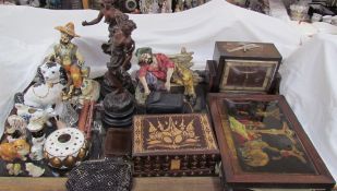 A pair of religious reverse painted prints together with a mantle clock, spelter figures,