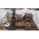 A pair of religious reverse painted prints together with a mantle clock, spelter figures,