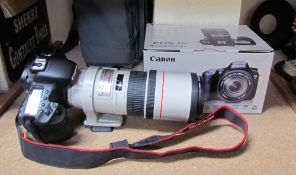 A Canon EOS 7D camera and canon EF 300mm 1:4 LIS lens CONDITION REPORT: Not sold as