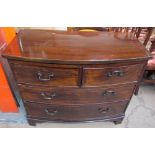 A 19th century mahogany chest with a bowed top above two short and two long drawers on bracket