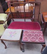 An Edwardian mahogany two seater settee together with a mahogany stool on claw and ball feet and a