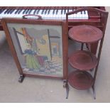 A woolwork fire screen together with a folding cake stand