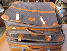 Two Louis Vuitton style suitcases