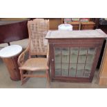 A birds eye maple bergère rocking chair together with an oak wall cabinet and a marble topped