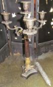 A bronze candelabra together with a white metal pierced container