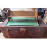 A leather suitcase together with a tray top table and an oak table top bookcase