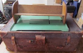 A leather suitcase together with a tray top table and an oak table top bookcase