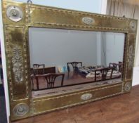A Brass and metal mounted mirror of rectangular form with a bevelled plate